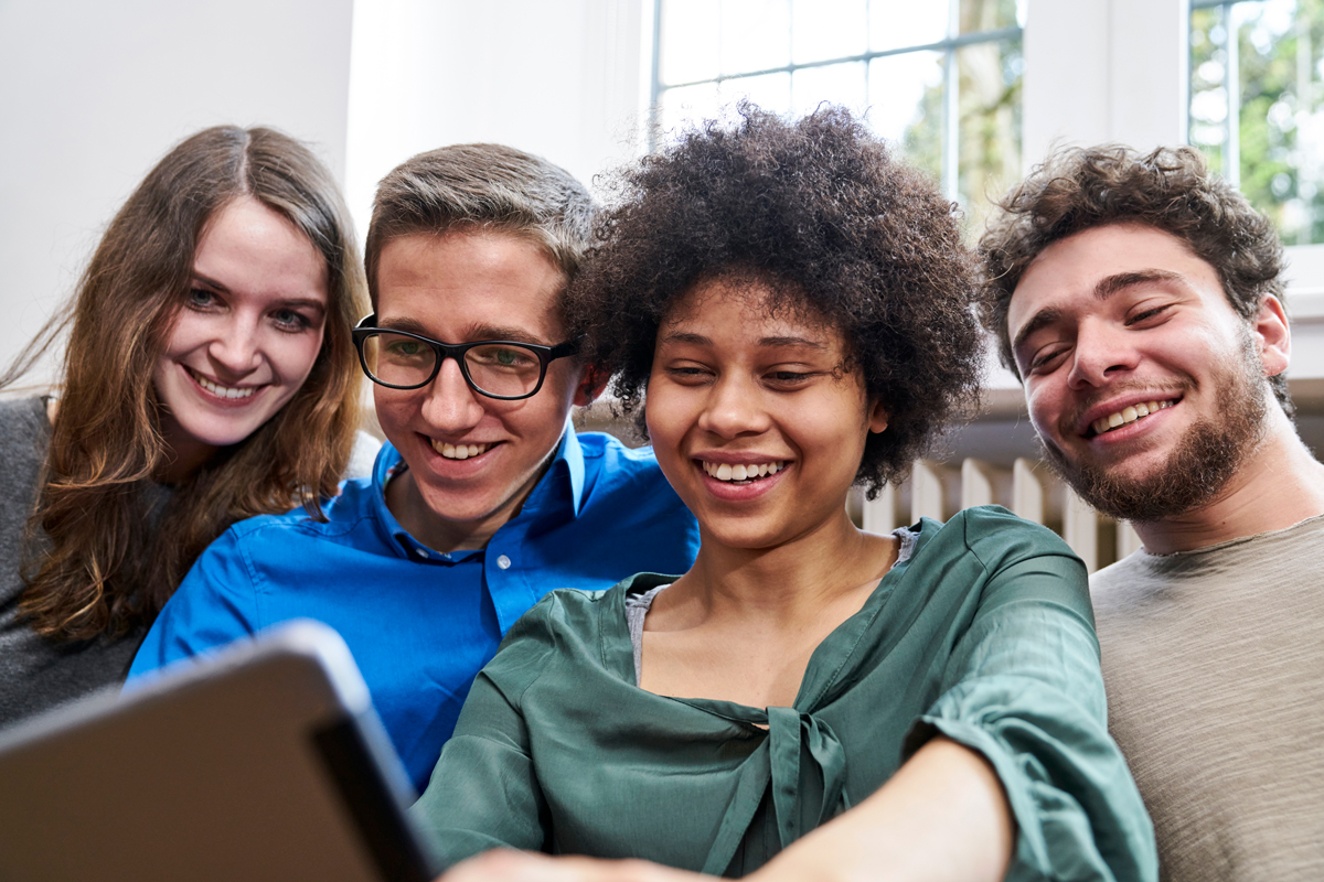 Smiling People Looking at Tablet